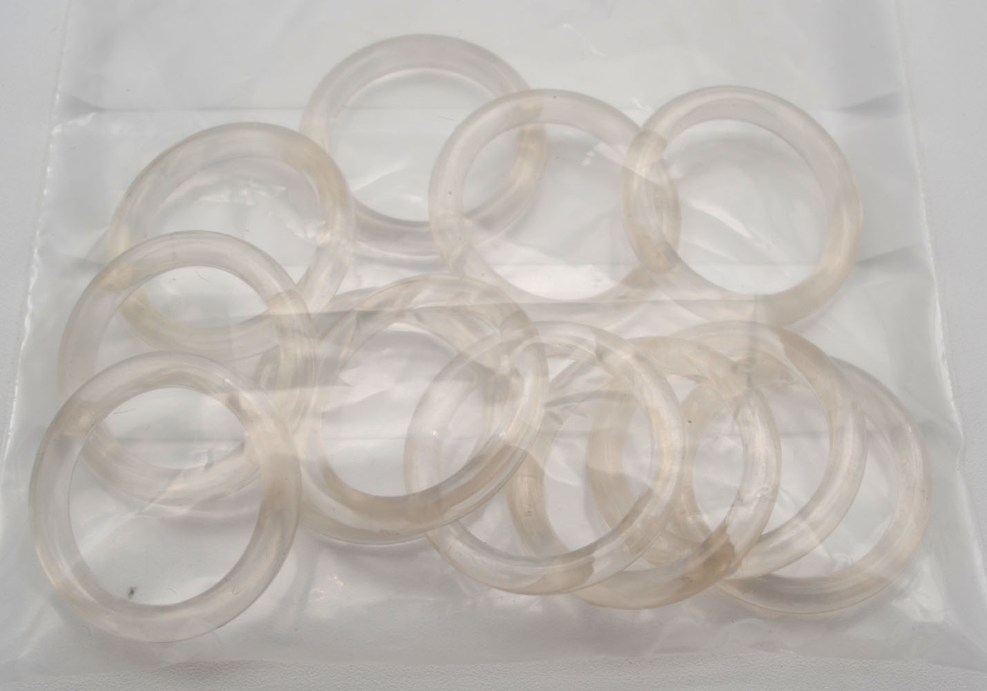 12 Kunststoffringe transparent für Stangen von 16-20 mm